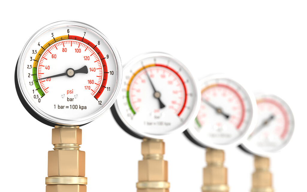 Image of four pressure gauges.